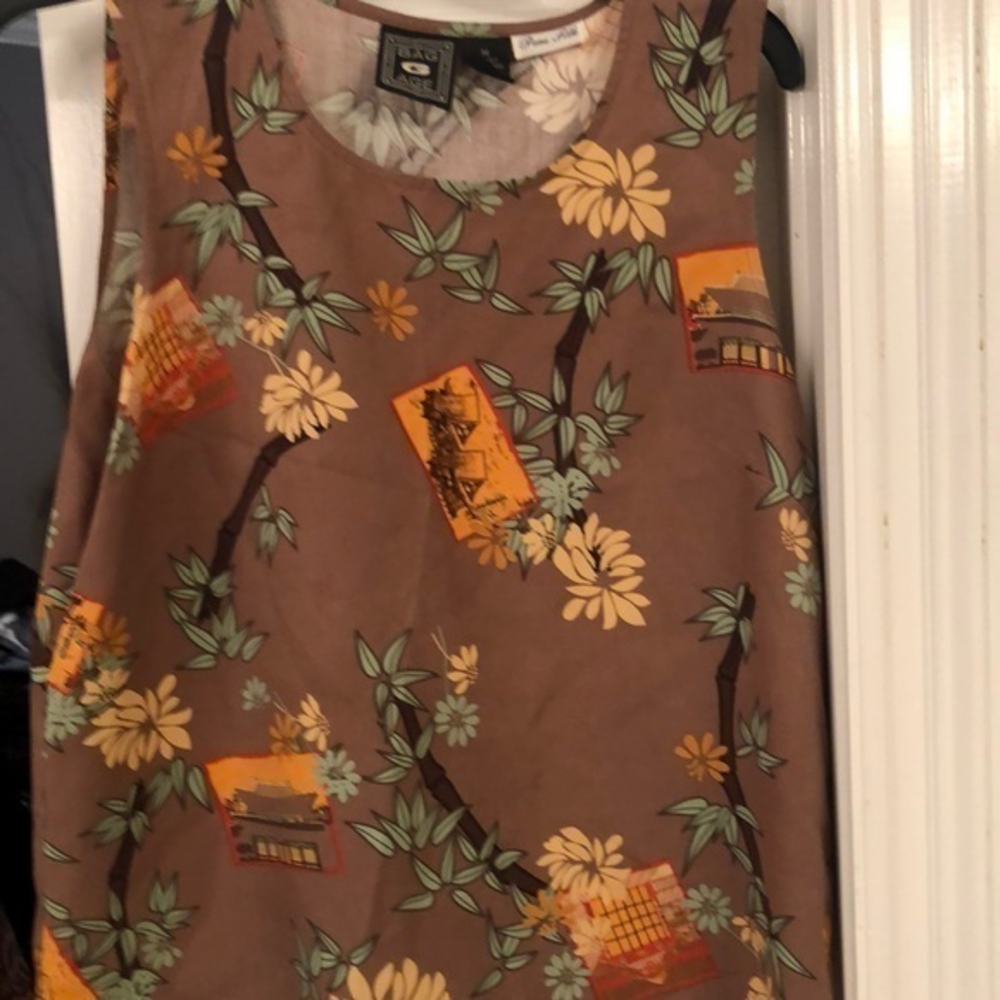 Size medium silk‎ sleeveless top would be really cute under a blue jean jacket